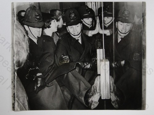 Police hold back - back, ready